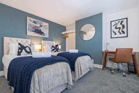 Bedroom 1 features a zip-link bed, set up as two single beds by default, which can be zipped together upon request.