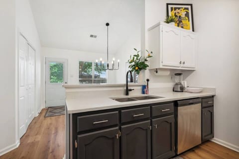 Step into our open and airy kitchen, where cooking is always a breeze and there's plenty of room for fun.