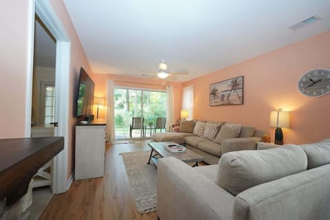 Spacious Living Space with Screened-In Porch Access