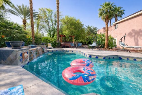 House #1 backyard with pool, spa, outdoor lounge, dining, and BBQ