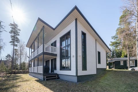 The building features a sunny terrace with a grill and an upstairs balcony.