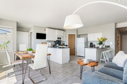 Stylish open-concept dining and kitchen area with modern decor.