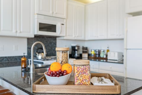 The kitchen is stocked with a variety of essentials, making it easy to whip up any meal and enjoy food galore!