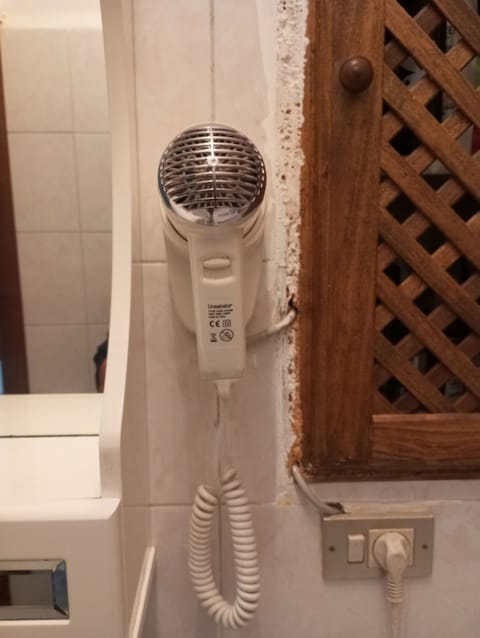 Hair dryer, towels, soap, shampoo