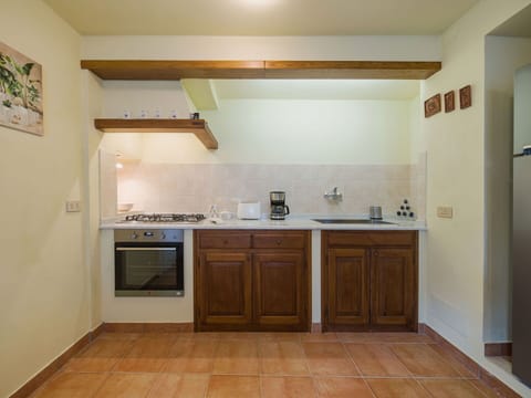 Countertop, Kitchen, Kitchen Appliance, Flooring, Furniture, Major Appliance, Interior Design, Cabinetry, Wood, Ceiling