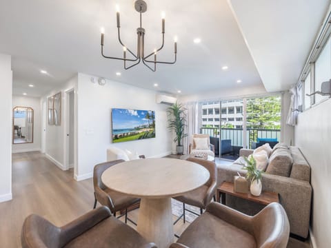 Living Area - Welcome to your retreat at Kuhio at Waikiki, a bright airy condo with open living and dining spaces filled with natural light, just a short walk to the beach and complete with free assigned parking.