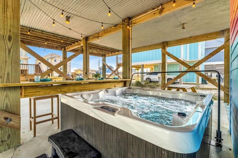 Relax in your private hot tub after a long day on the beach, listening to waves.