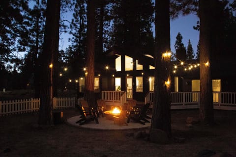 Your private fire pit awaits beneath towering pines, where twinkling string lights create a magical forest sanctuary. Gather around the crackling flames in cozy Adirondack chairs and let the woodland atmosphere melt away your worries.