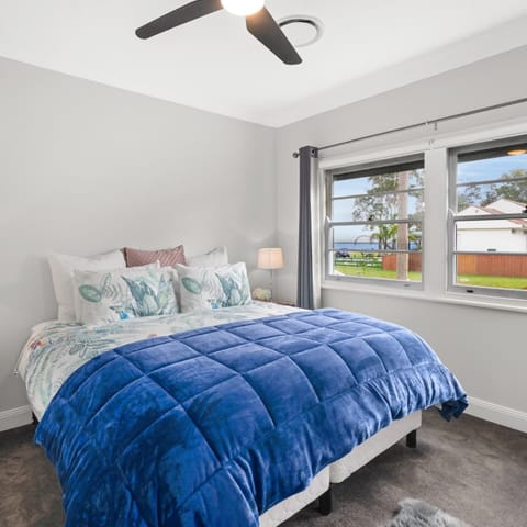 Main bedroom King size bed, 2 bedsides, roller shutters on the outside windows
