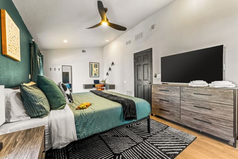 A comfy bed and in-room TV make this master the perfect place to chill after a full day.