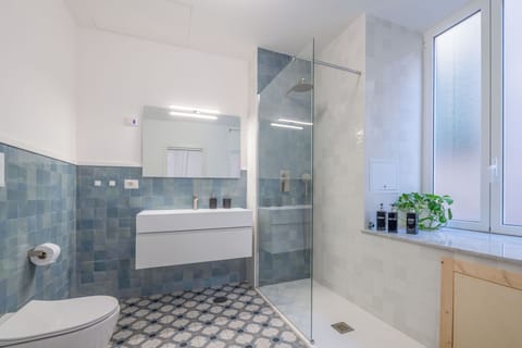 Deluxe Townhome, Balcony | Bathroom | Shower, hair dryer, bathrobes, towels