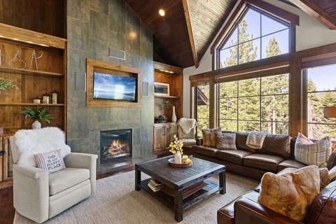 Living Room: Stunning views and inviting warmth await in this stylish, wood-accented retreat!