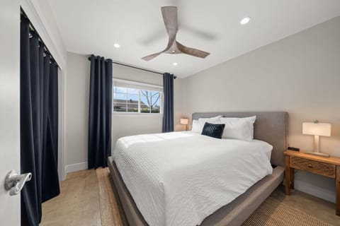 Drift off in ultimate comfort on this Cal King mattress.  Control your privacy and light with 2-inch louvered blinds and blackout curtains. Charging stations and bedside lights on both sides of the bed at the Huntington Beach Vacation Rental. 