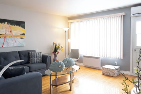 Inviting plush gray sectional with stylish decor to unwind and feel at home!