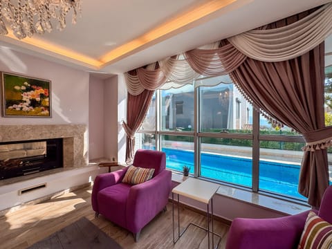 Comfort Villa, Pool View | Living area | 100-cm plasma TV with digital channels, Netflix, heated floors