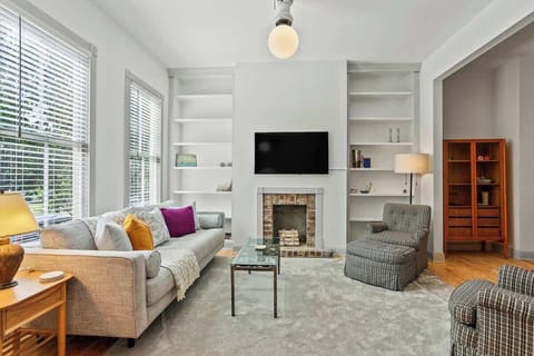 Wall of windows and an open layout fill this home with tons of natural light. Enjoy your favorite show on our 50" Smart TV, or grab a board game and challenge the whole family to some fun.