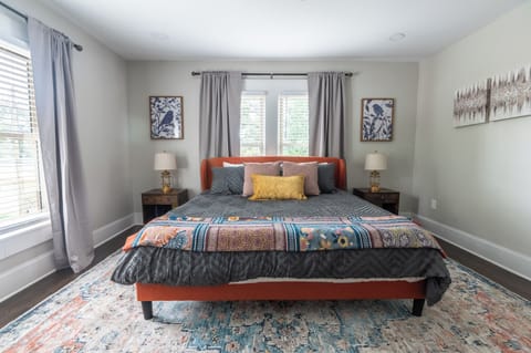 Ultimate Comfort: Enjoy our spacious master bedroom with a king-sized bed, large closet, smart TV, and a cozy reading nook perfect for unwinding. 