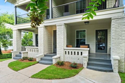 Relax on the cozy porch of Unit 2, perfect for enjoying the quiet neighborhood vibe with a morning coffee or winding down in the evening.