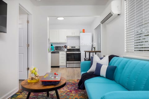 Living room with view into the kitchen.