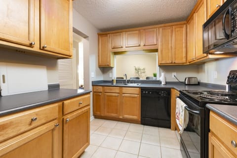 Fully Equipped Kitchen: Prepare meals effortlessly in this modern kitchen with updated appliances.