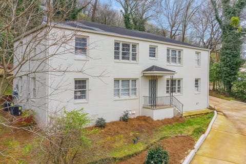 The clean lines of this well-maintained building are complemented by lush greenery, making this property both modern and inviting.