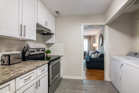 Functional kitchen view with full appliances, spacious counters, and easy access to the rest of the home.
