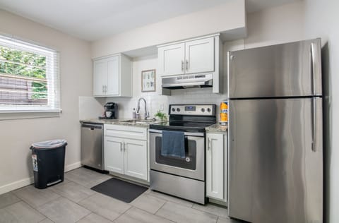 Open kitchen layout with natural light, full-size appliances, and all the basics covered.