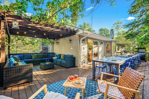 Spacious upper deck area with seating and dining space for everyone!  BBQ grill.