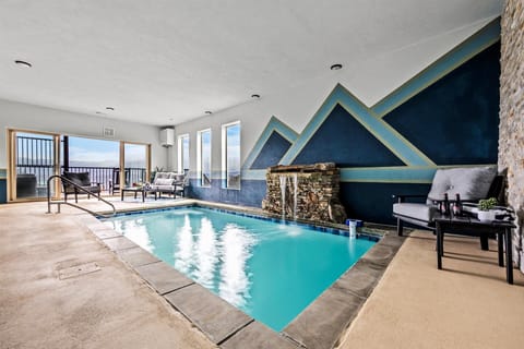 Relax and unwind in our private heated indoor pool with breathtaking mountain views!