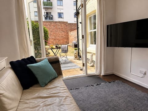 Open plan living area with enclosed garden