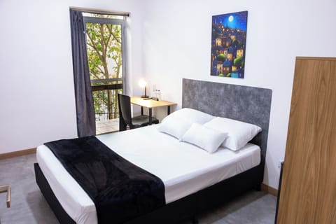 Standard Double Room, Private Bathroom, City View | Minibar, desk, laptop workspace, blackout drapes
