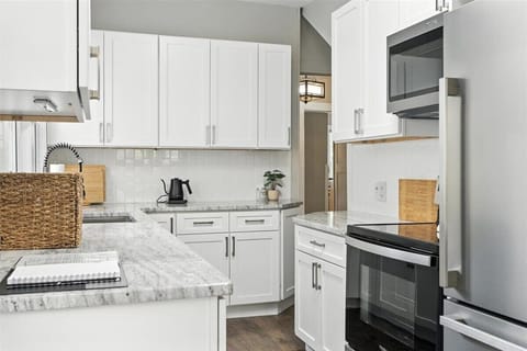 Full size fridge,  electric cooktop and oven, Microwave.  Fully Stocked.