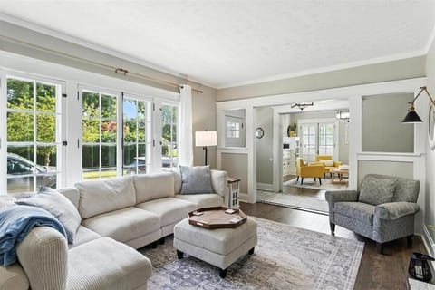 Living room on Main floor.  Sectional sofa, arm chair and tv.