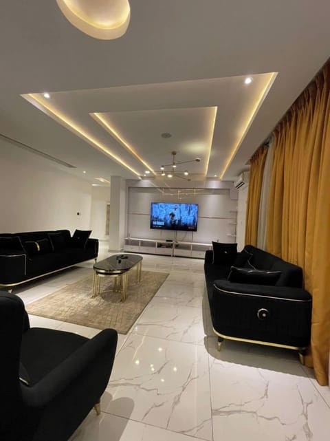 Economy Apartment, Balcony, City View | Living area | Flat-screen TV