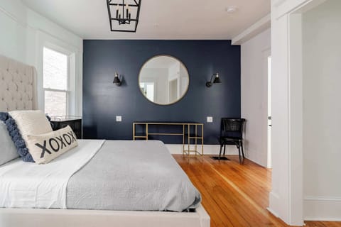 Bedroom 1 with queen bed and desk.