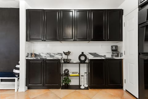 Fully Equipped Kitchen with silverware and dinnerware wine glasses.