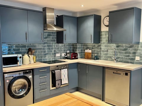Full kitchen, recently renovated, with dishwasher and washer/dryer.