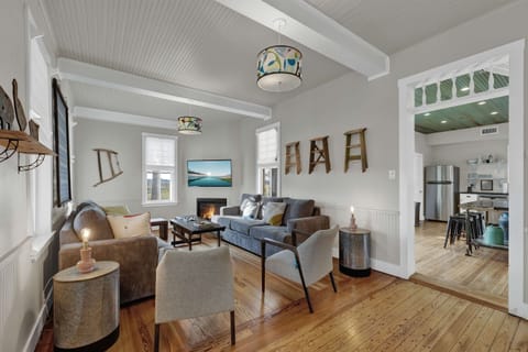 The living room is warm, open, and designed for together time. Whether you’re sipping wine, swapping stories, or diving into a late-night movie, it’s the perfect space to reconnect and relax.