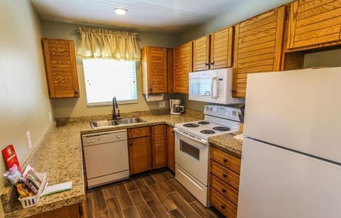 Enjoy cooking in this fully equipped kitchen with modern appliances and ample counter space, perfect for whipping up family meals after a day on the slopes.