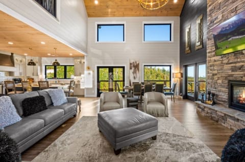 Beautifully furnished living room with open concept to dining and kitchen area.