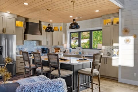 Beautiful custom kitchen with granite countertops, bar area with seating for 5.