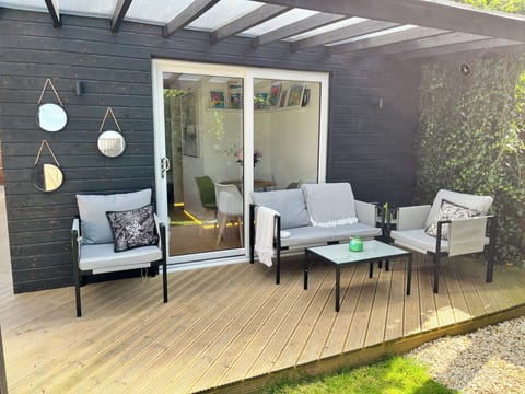 Step into your private garden space, complete with stylish outdoor furniture — perfect for morning coffees or evening wine under the stars.