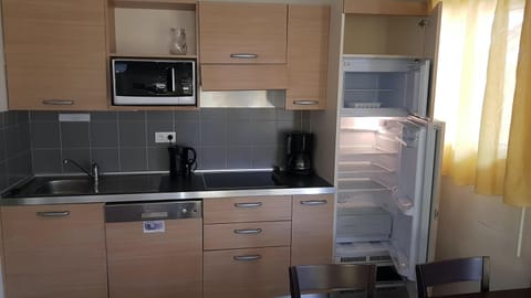 Cook a meal in the kitchen.