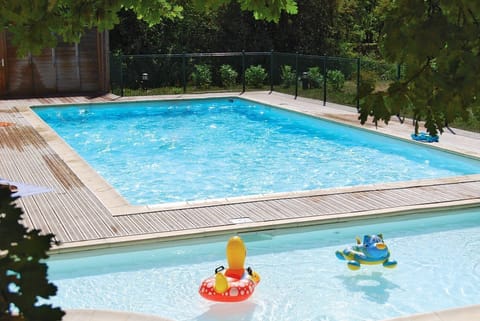 Take in forested views while lounging around the on-site seasonal outdoor pool.