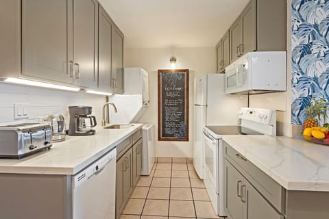 Island-inspired touches meet modern convenience in this tropical kitchen.
