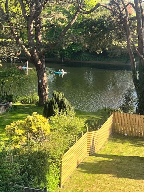 View from lounge window over looking garden down to the river
