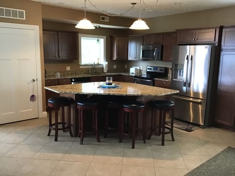 Open concept kitchen with stainless steel appliances