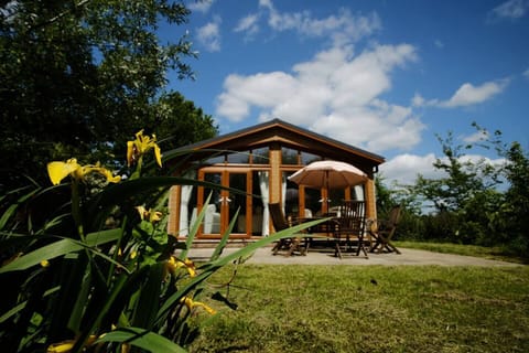 Looking back at Oak lodge from the fishing lake, this patio and garden area is fenced. 