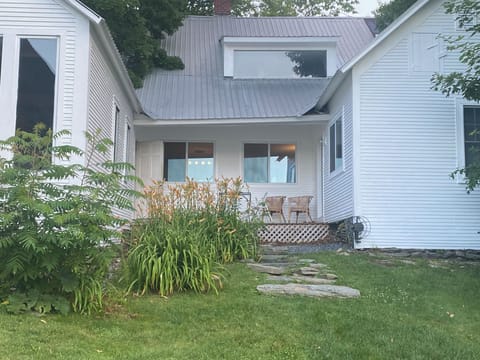 Step out from the kitchen onto a peaceful back porch - perfect for morning coffee or evening unwinding, with views of the spacious backyard