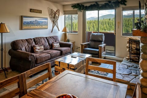 Unwind with family and friends in the bright living room with mountain views.